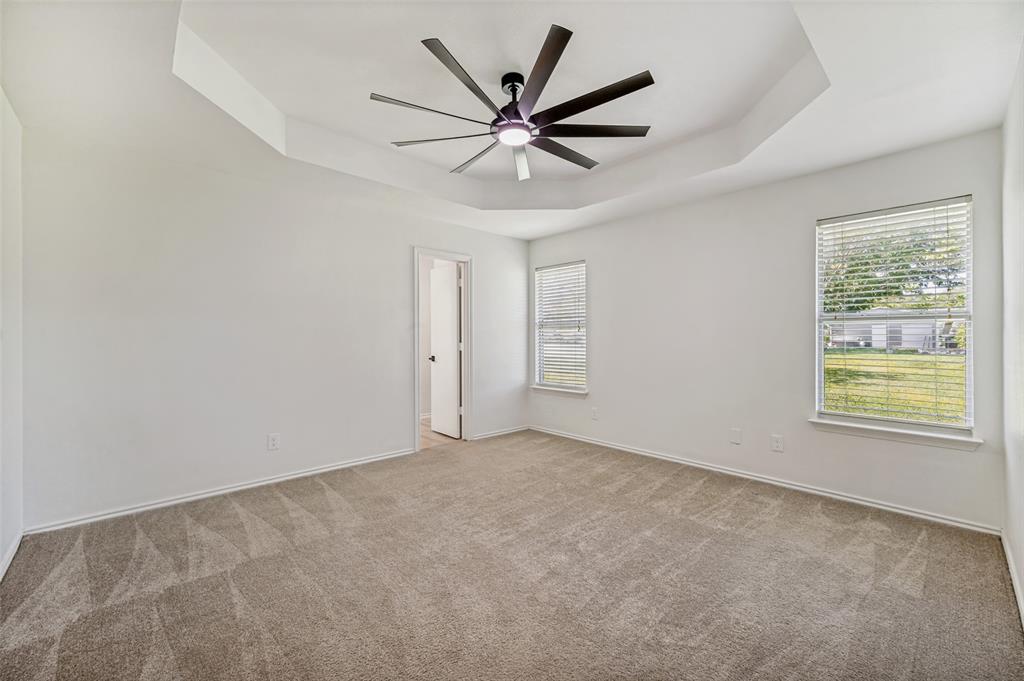 629 Concho Drive Oak Point, TX 75068 - Photo 18 of 35 a view of a livingroom with a ceiling fan and window