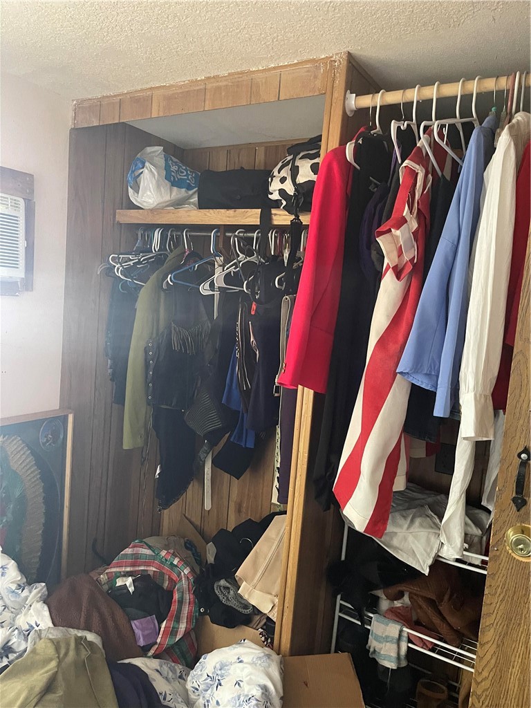 26611 Nudgent Street, Unit 28 Boron, CA 93516 - Photo 11 of 12 a view of walk in closet with clothes and shoes