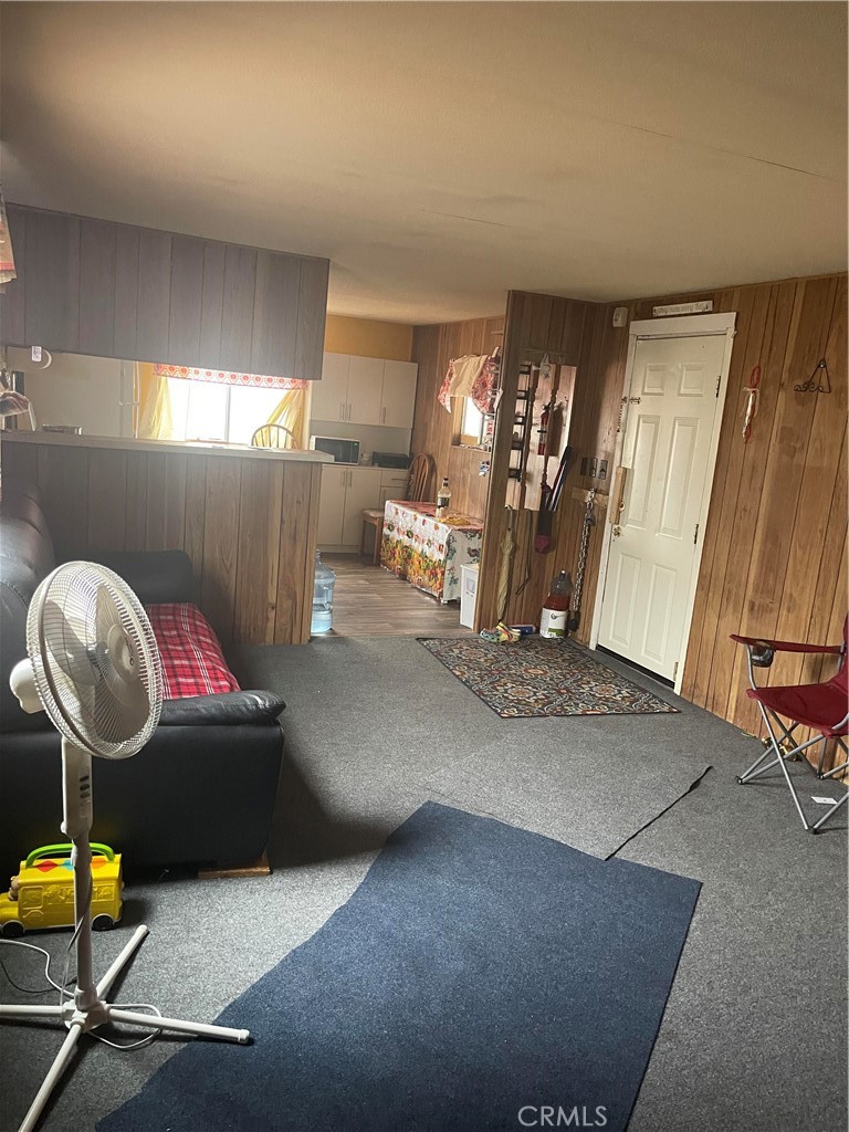 26611 Nudgent Street, Unit 28 Boron, CA 93516 - Photo 5 of 12 a living room with furniture a air conditioner vent and a window