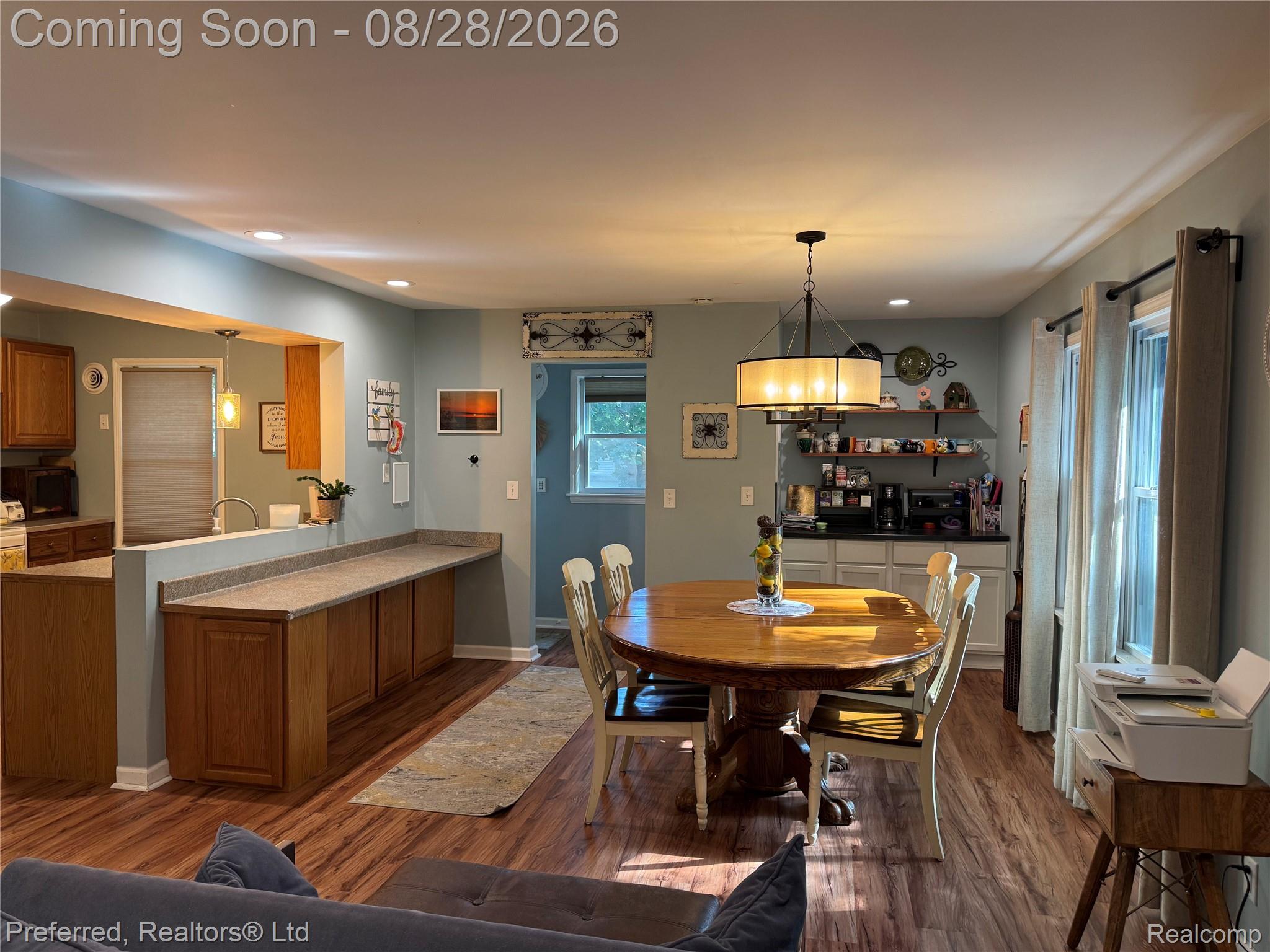 10362 Quirk Road Belleville, MI 48111 - Photo 17 of 41 Snack Bar, Dining, and Coffee Bar flow together nicely in this Open-concept room with wood-finish vinyl flooring, recessed lighting
