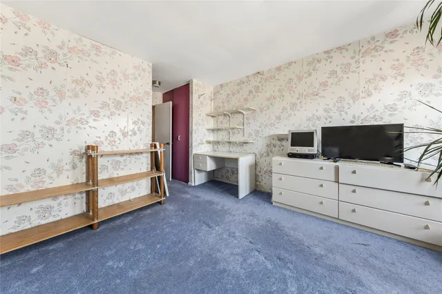 a living room with a flat screen tv and a fireplace