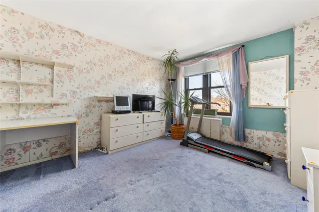 a view of a livingroom with furniture and a flat screen tv
