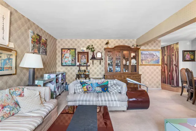 a living room with furniture and a lamp