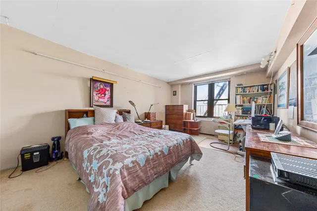 a bed room with a bed and a couch