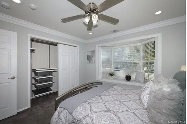 a bed room with a bed and a window