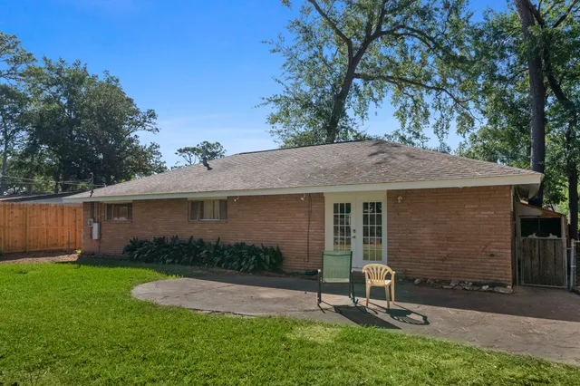 a view of a backyard with a sitting area and furniture