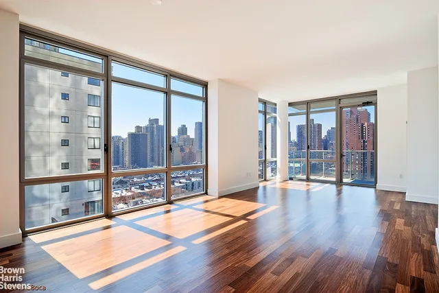 a kitchen with a sink a microwave and cabinets