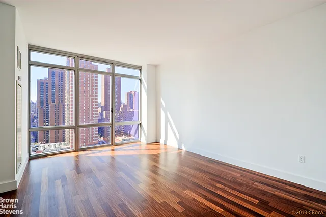 a bathroom with a double vanity sink toilet and a mirror