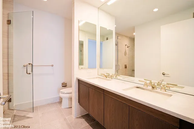 wooden floor in a hall with a large window