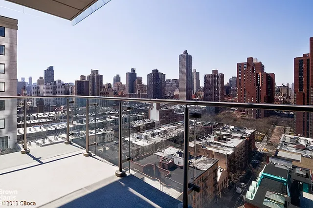a view of a lake with a city skyline in the background