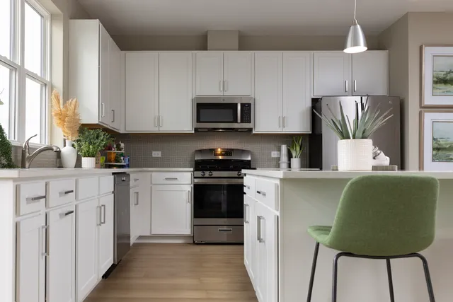 a kitchen with a cabinets and appliances