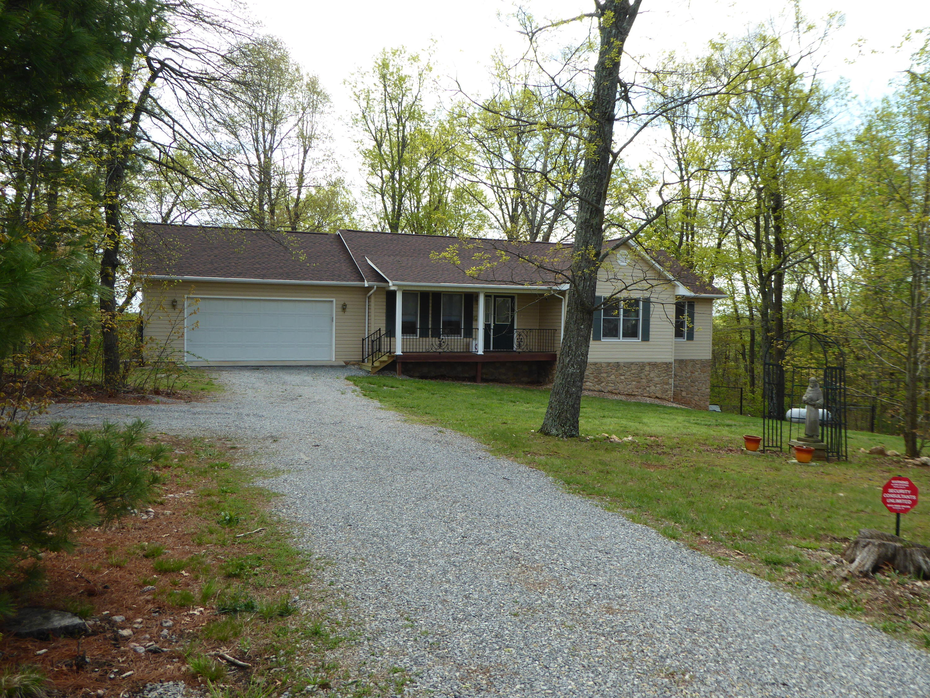 2420 Hardy Road Hardy, VA 24101 - Photo 19 of 19 a front view of a house with a garden and trees