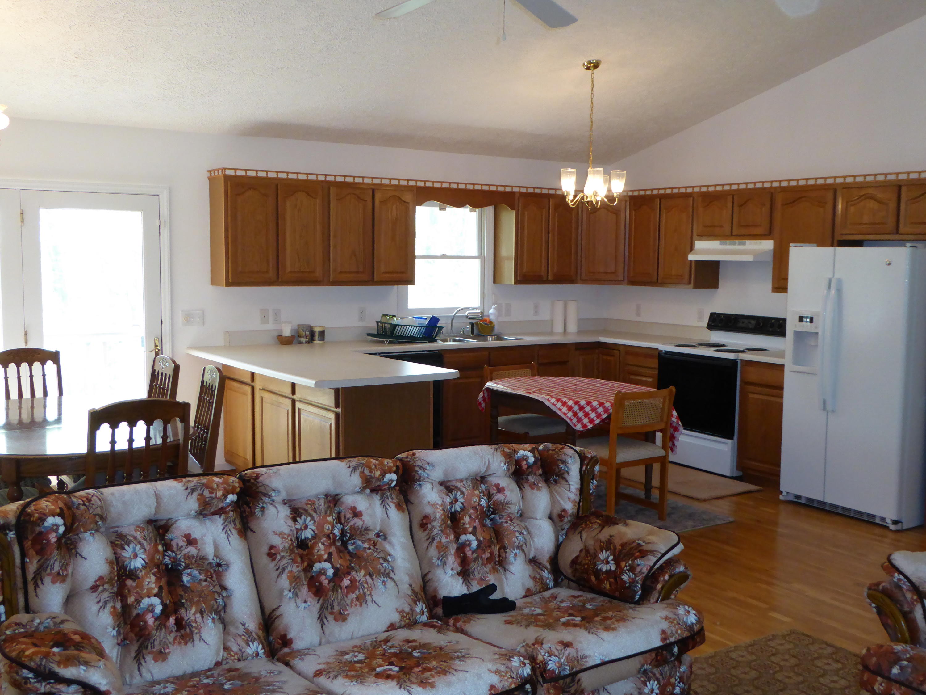2420 Hardy Road Hardy, VA 24101 - Photo 3 of 19 a kitchen with stainless steel appliances granite countertop a sink dishwasher a stove a refrigerator and a dining table with wooden floor