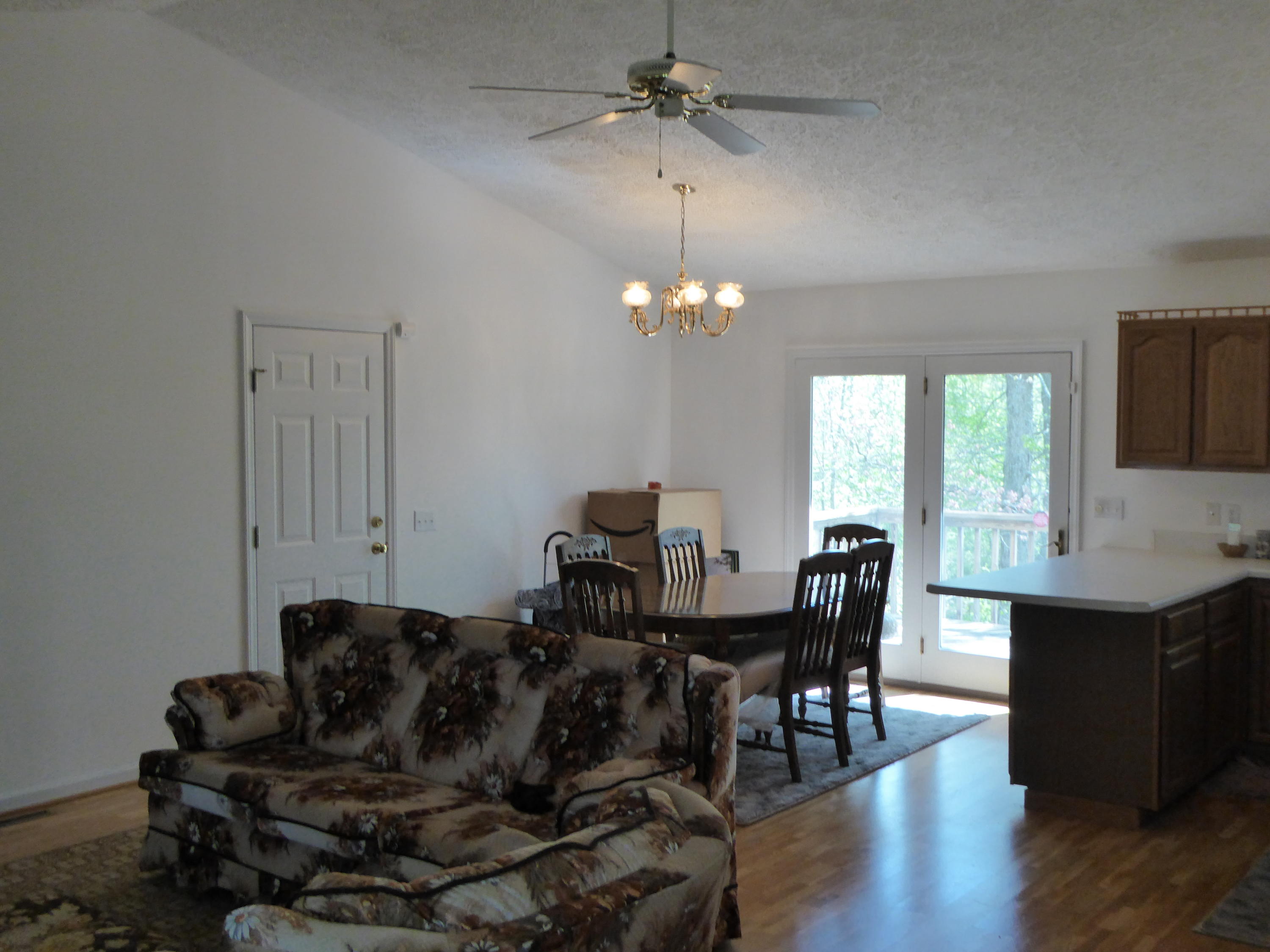 2420 Hardy Road Hardy, VA 24101 - Photo 4 of 19 a living room with furniture a dining table and a chandelier