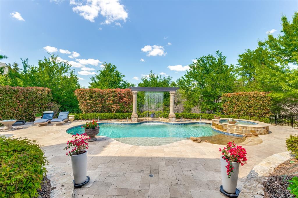 a view of a fountain in front of a house