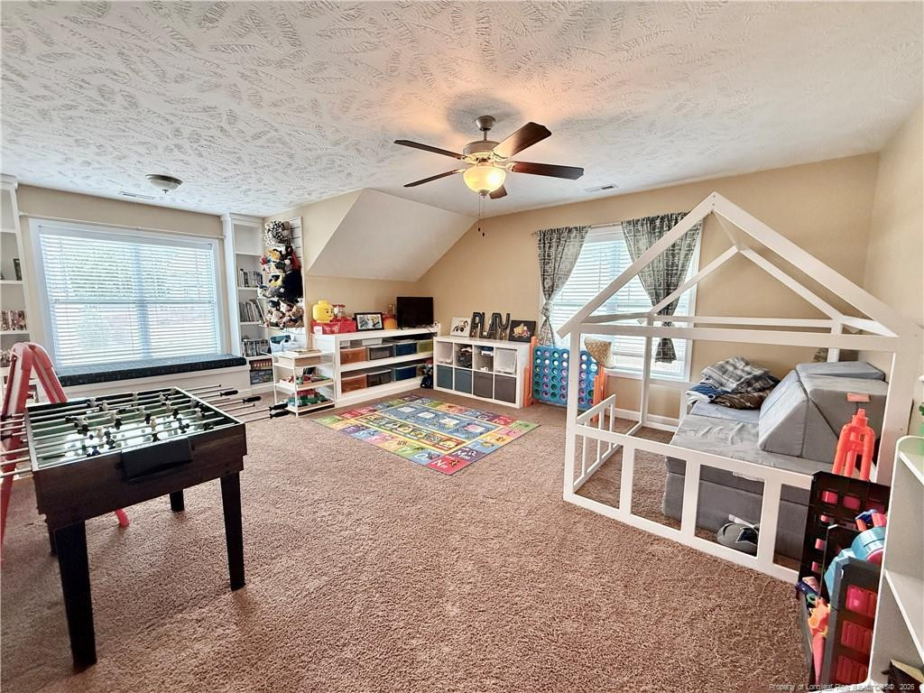 35 Ambrose Point Cameron, NC 28326 - Photo 24 of 31 a living room with furniture a flat screen tv and a window