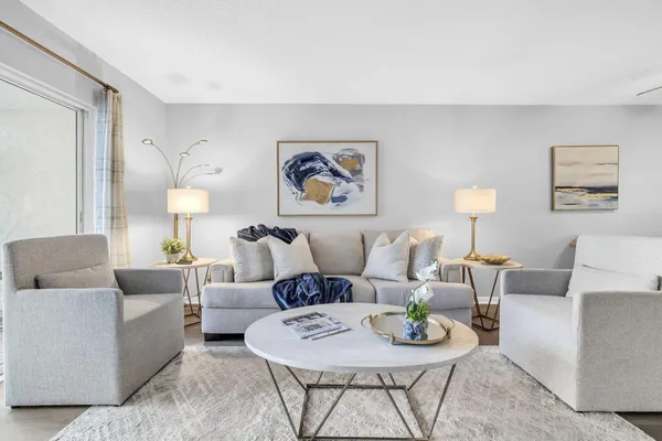 a living room with furniture and a lamp