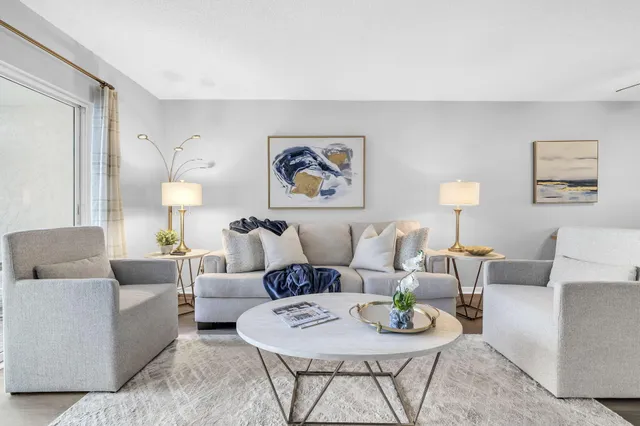 a living room with furniture and a lamp