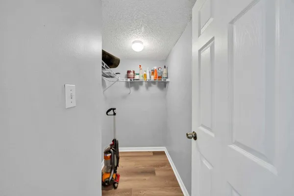 a living room with furniture a mirror and a flat screen tv