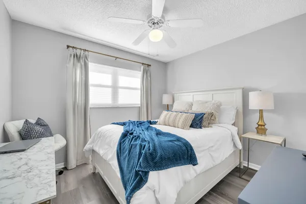 a view of a swimming pool with an outdoor seating