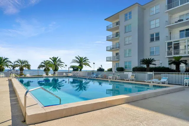 a view of a building and potted plants