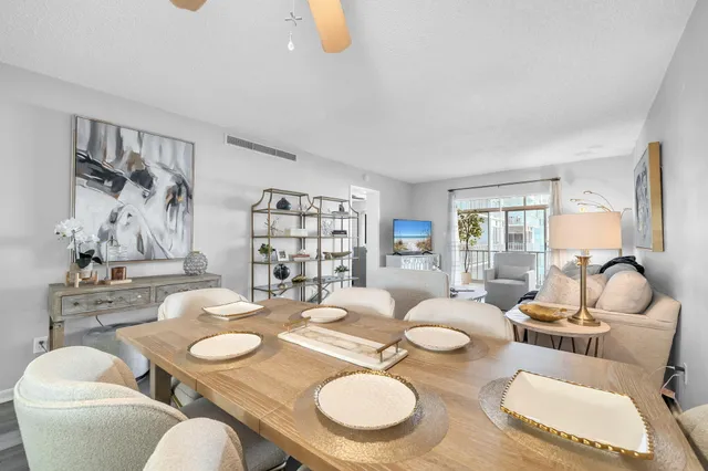 a dining room with furniture and wooden floor