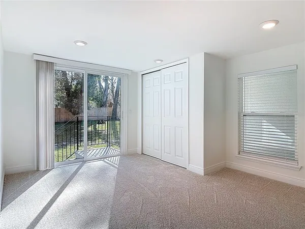 a view of a room with large windows