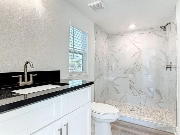 a bathroom with a sink and a toilet
