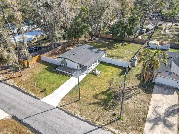 an aerial view of a house with swimming pool