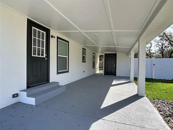a view of front door and yard