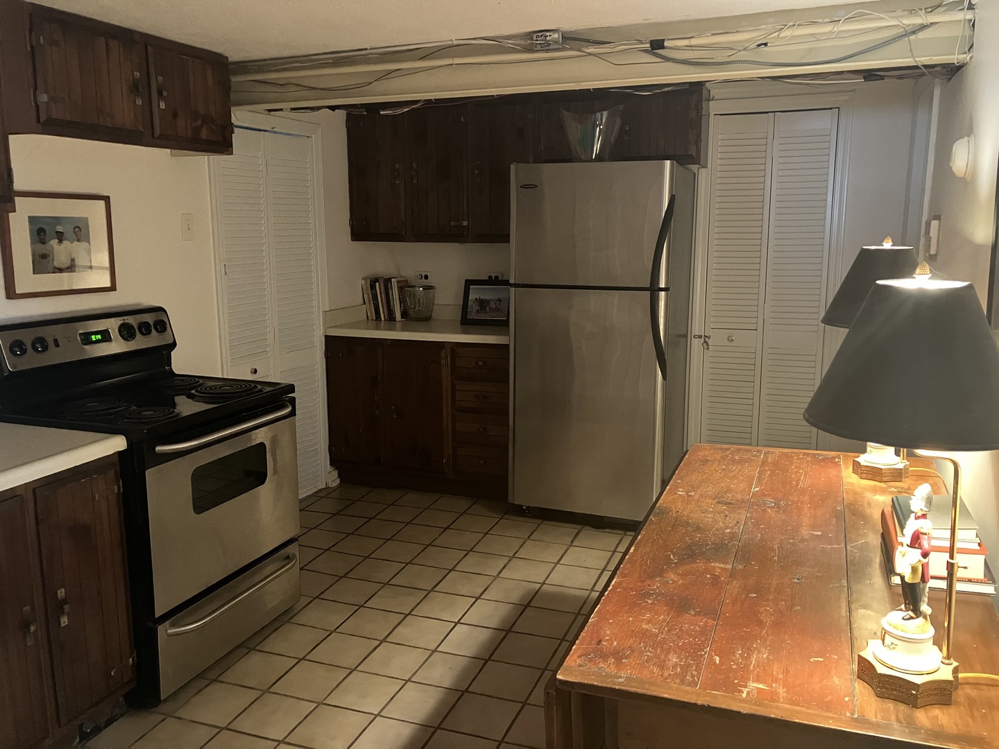 111 Church Road Winnetka, IL 60093 - Photo 11 of 12 a kitchen with stainless steel appliances granite countertop a refrigerator and a stove