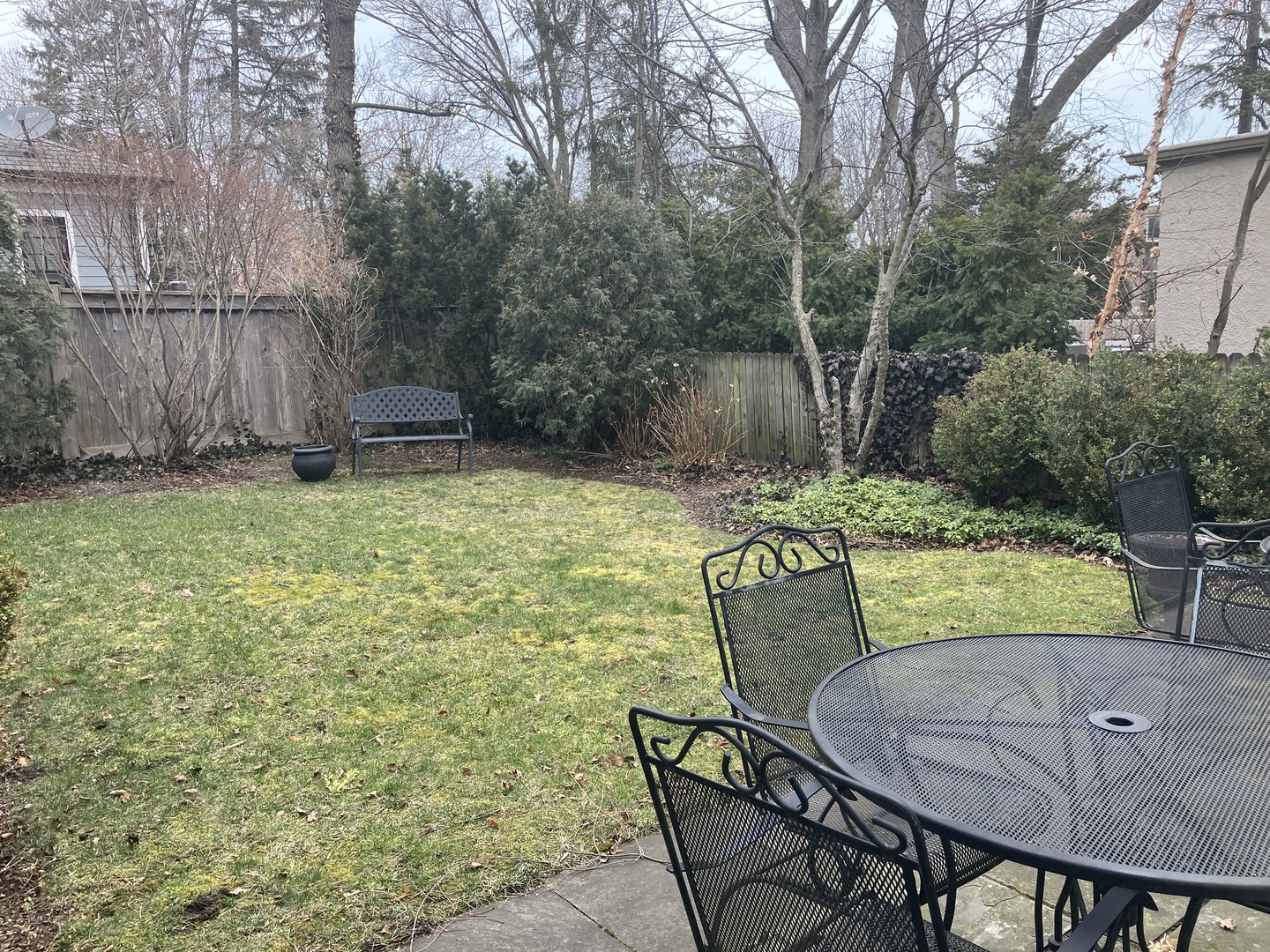 111 Church Road Winnetka, IL 60093 - Photo 12 of 12 a view of a chairs and table in backyard