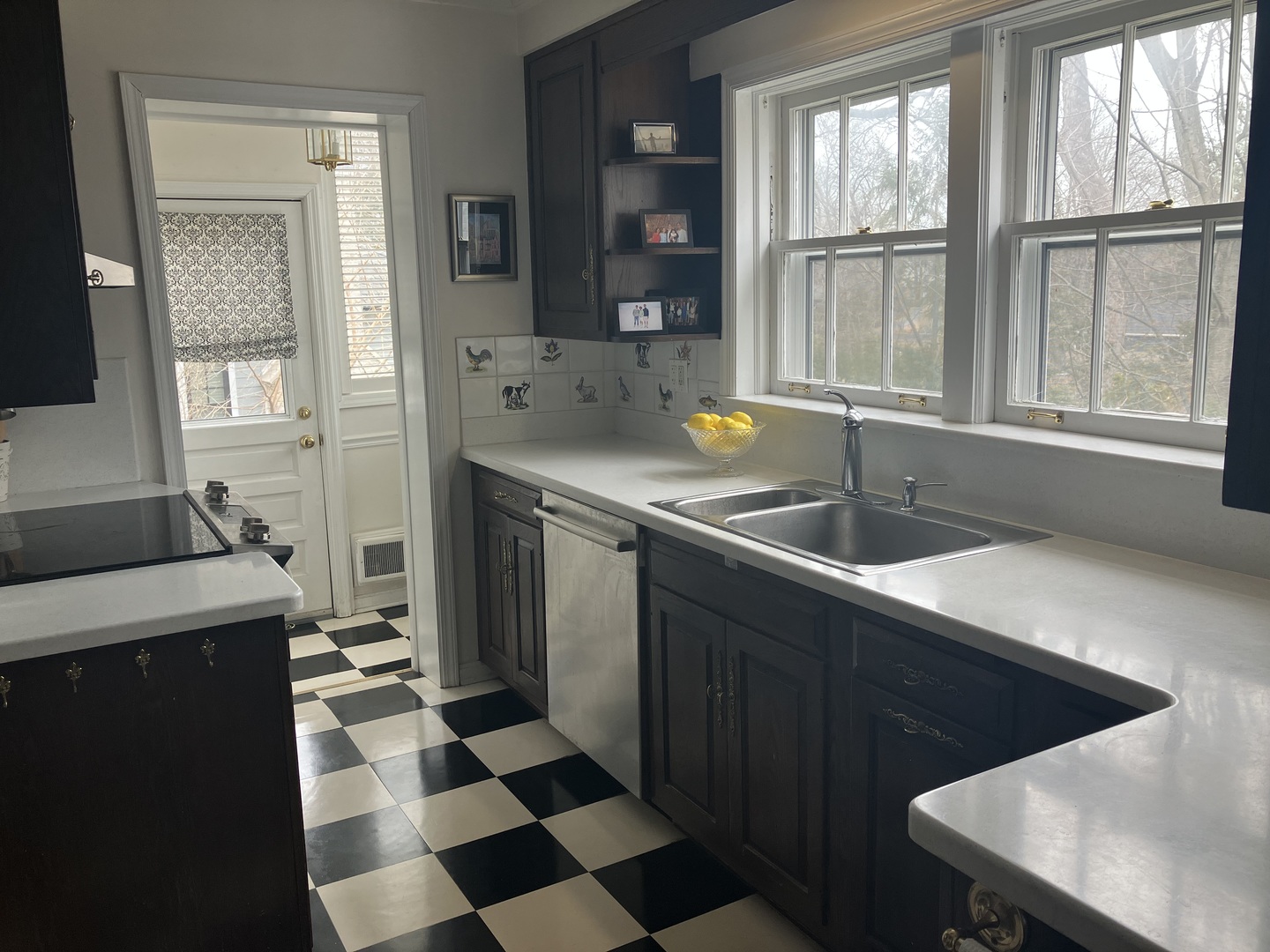 111 Church Road Winnetka, IL 60093 - Photo 6 of 12 a kitchen with a sink a stove and a refrigerator