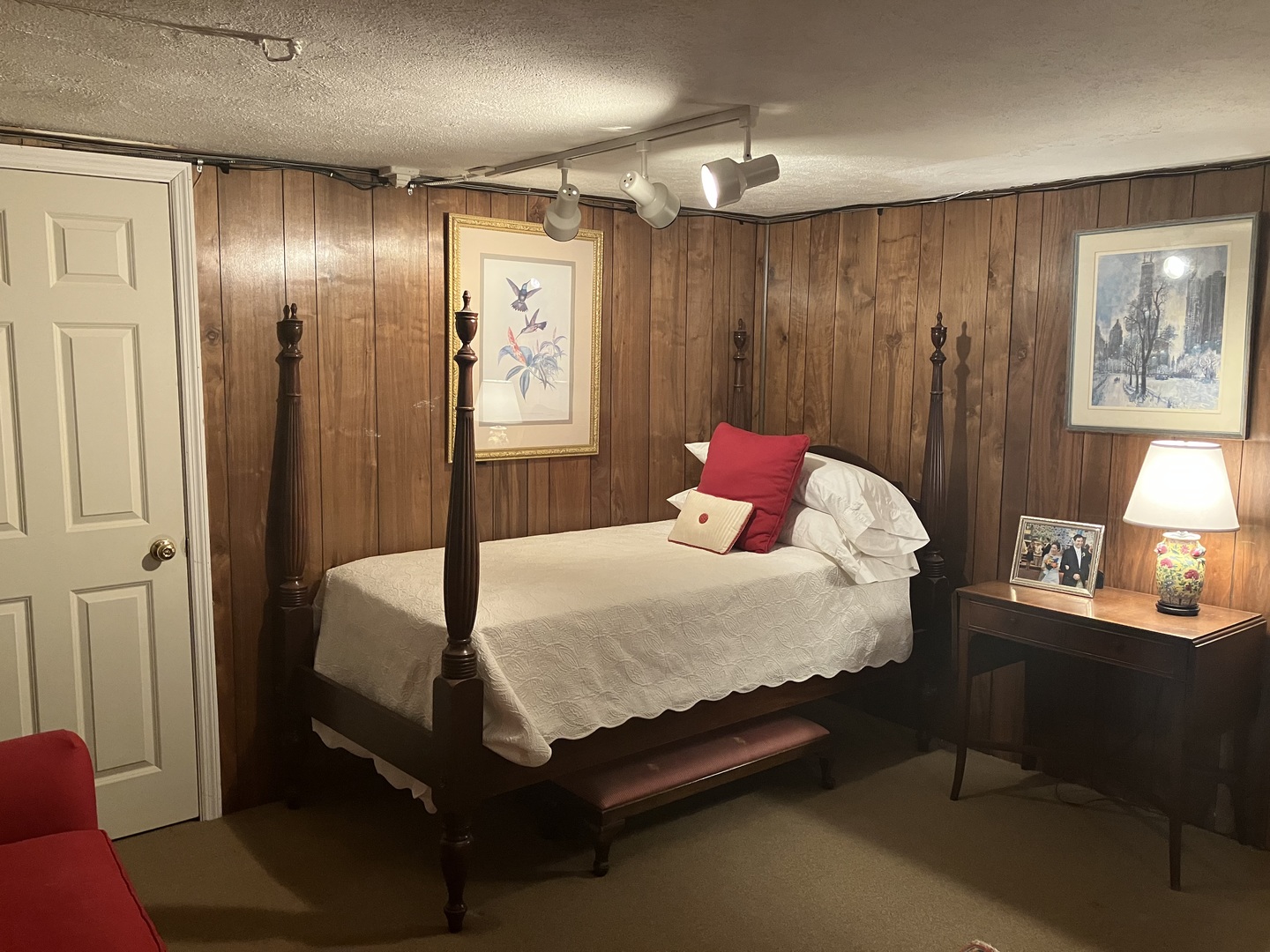 111 Church Road Winnetka, IL 60093 - Photo 10 of 12 a bedroom with a bed and a chandelier