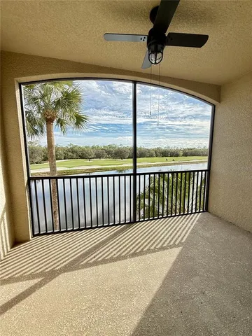 a view of a balcony with wooden floor