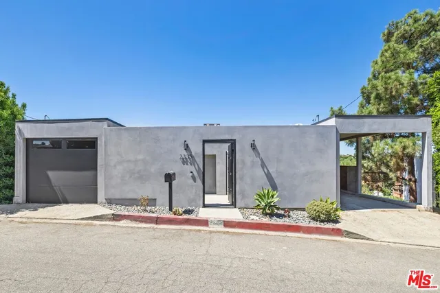 front view of a house with a street