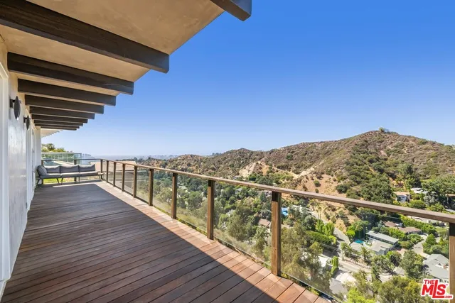 a view of balcony with furniture