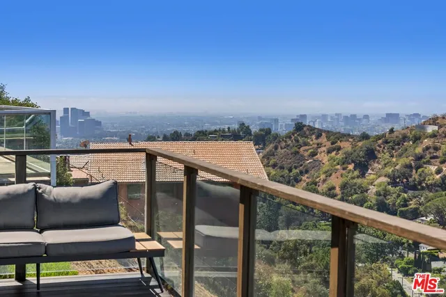 a view of a balcony with furniture