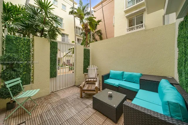 a view of outdoor seating space with furniture