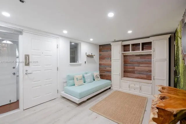 a spacious bedroom with a bed and a dresser