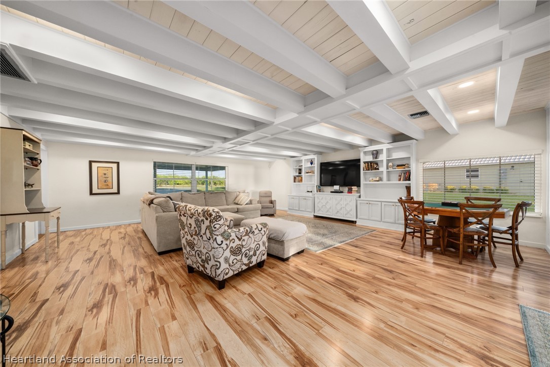 1843 South Lake Reedy Boulevard Frostproof, FL 33843 - Photo 15 of 50 a living room with furniture and wooden floor