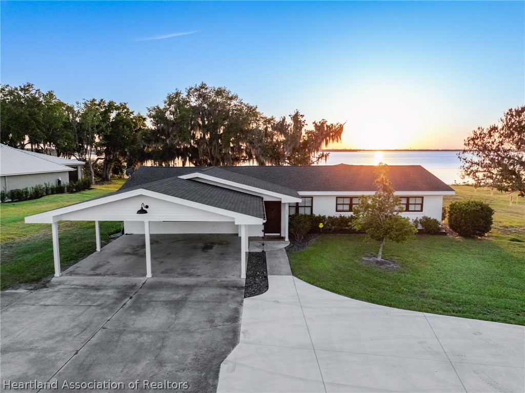 1843 South Lake Reedy Boulevard Frostproof, FL 33843 - Photo 2 of 50 front view of a house with a yard