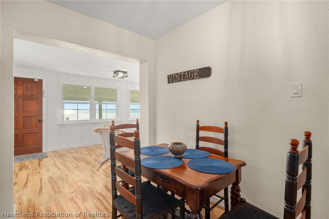 1843 South Lake Reedy Boulevard Frostproof, FL 33843 - Photo 24 of 50 a bedroom with a bed and a table in it