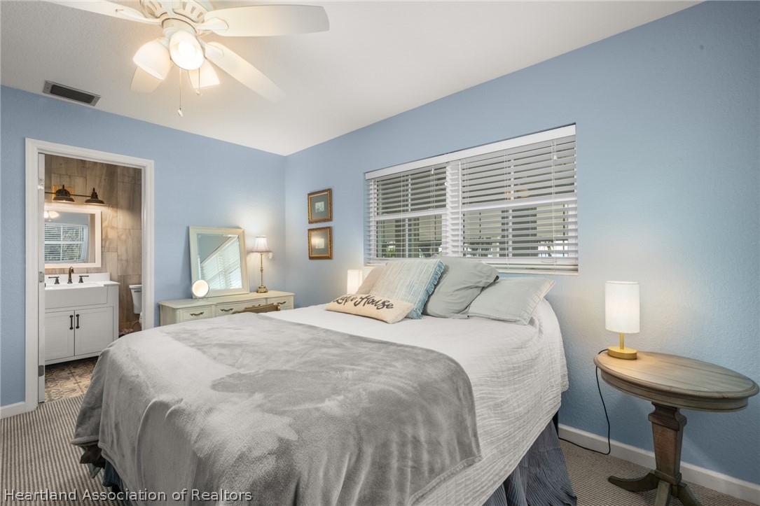 1843 South Lake Reedy Boulevard Frostproof, FL 33843 - Photo 35 of 50 a bedroom with a bed and a window