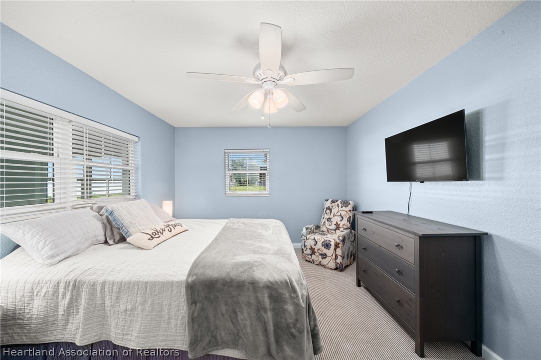 1843 South Lake Reedy Boulevard Frostproof, FL 33843 - Photo 37 of 50 a bedroom with a bed and a flat screen tv