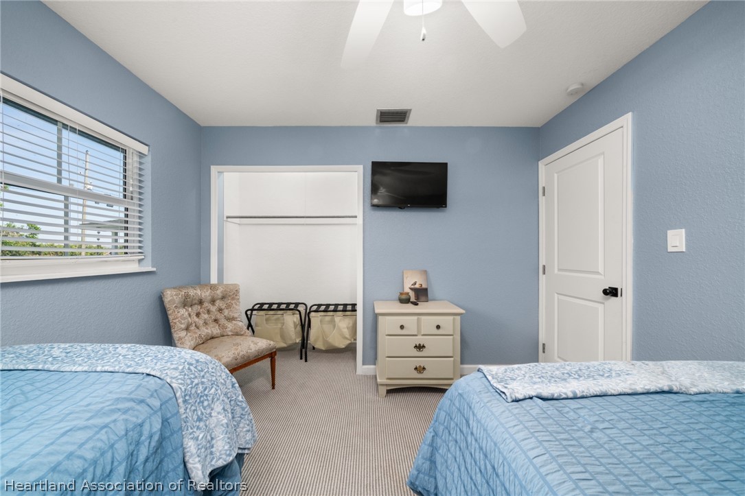 1843 South Lake Reedy Boulevard Frostproof, FL 33843 - Photo 43 of 50 a bedroom with bed and window