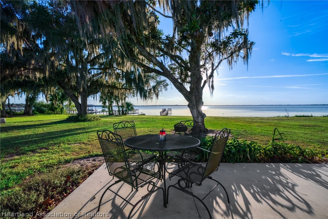 1843 South Lake Reedy Boulevard Frostproof, FL 33843 - Photo 46 of 50 a backyard of a house with table and chairs