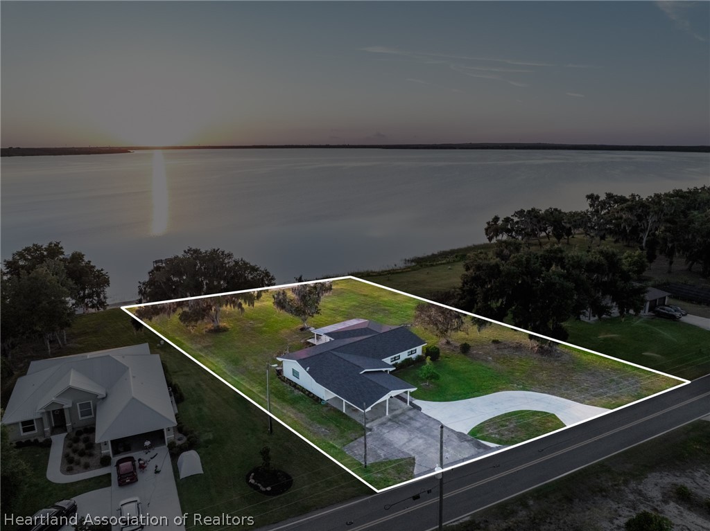 1843 South Lake Reedy Boulevard Frostproof, FL 33843 - Photo 6 of 50 an aerial view of a backyard