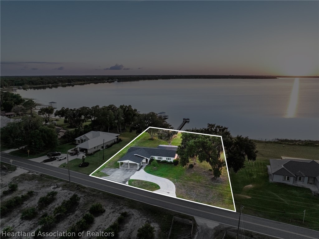 1843 South Lake Reedy Boulevard Frostproof, FL 33843 - Photo 8 of 50 a view of a balcony with wooden floor and lake view