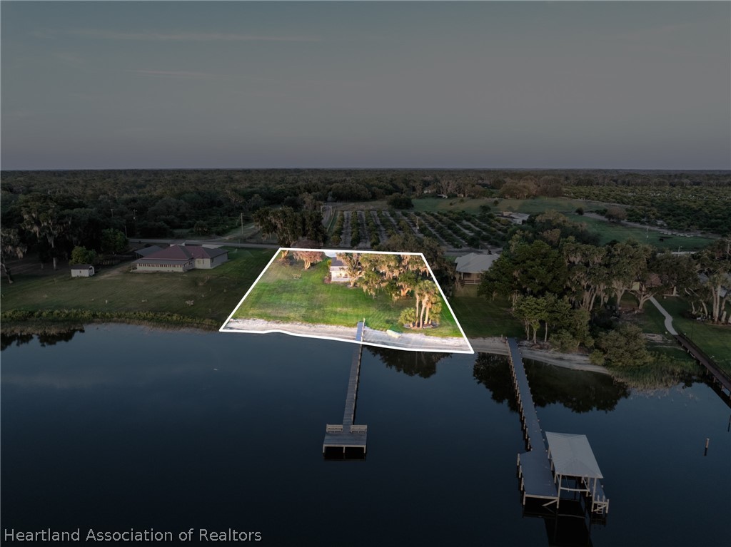 1843 South Lake Reedy Boulevard Frostproof, FL 33843 - Photo 9 of 50 an aerial view of a house with yard table and chairs